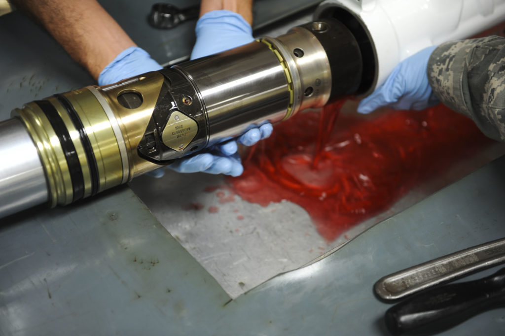 hydraulic fluid contamination in red hydraulic fluid application
